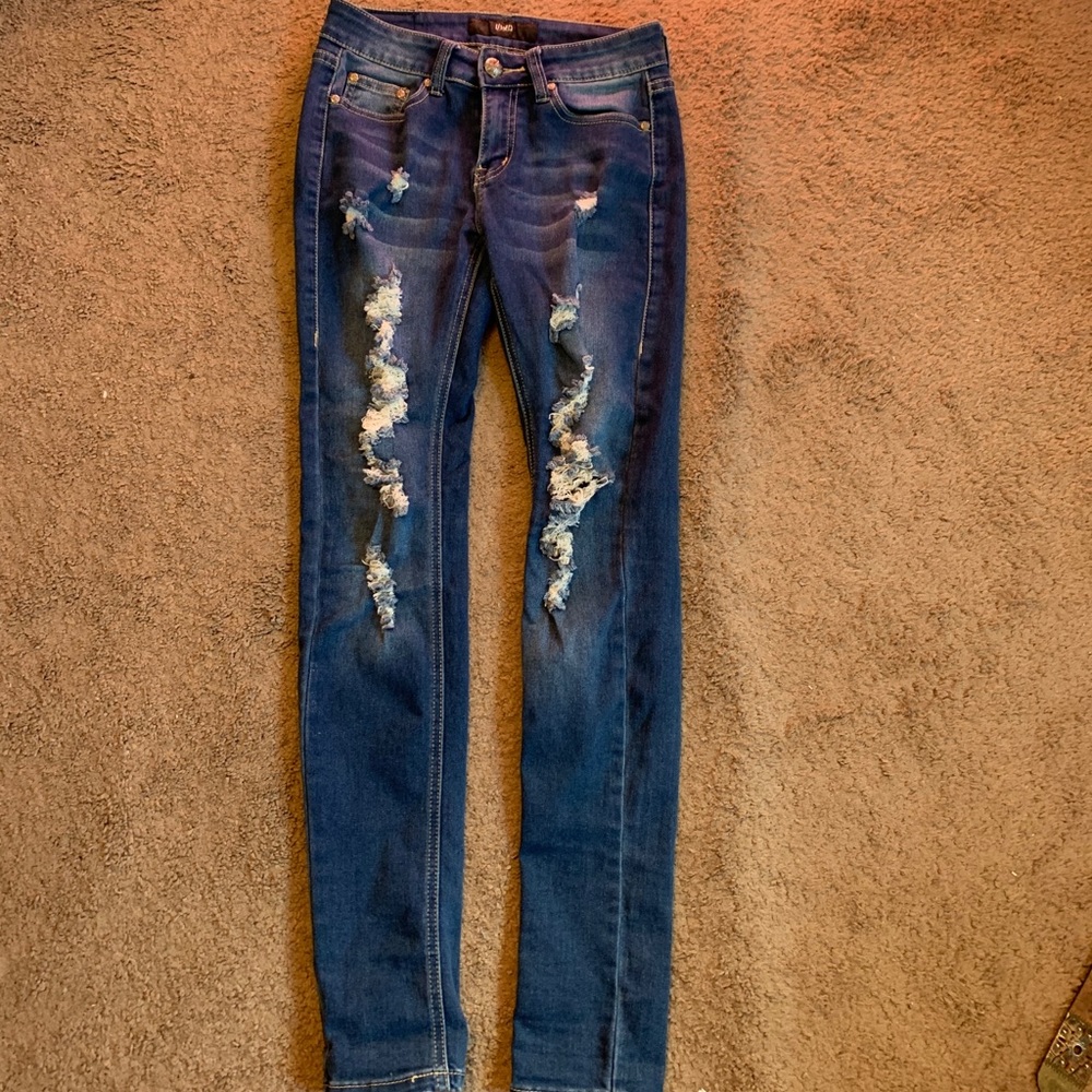 Dark colored ripped jeans